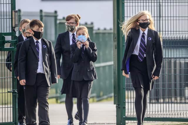Students wearing face coverings at school.