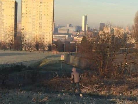 Nathan Rawson pictured running from the scene in the direction of Leeds city centre after he was disarmed by the schoolgirl he attacked at knife-point.