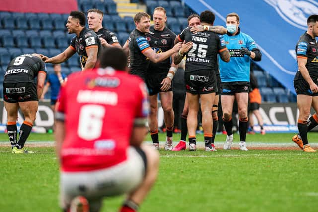 Castleford's players celebrate their Challenge Cup quarter-final win over Salford Red Devils. (Alex Whitehead/SWpix.com)