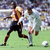 OUT IN FRONT: Leeds United forward Mark Viduka, one of six different scorers for the Whites, is challenged by Jamie Lawrence in the 6-1 rout of Bradford City at Elland Road of May 13, 2001. Picture by Alex Livesey/ALLSPORT via Getty Images.