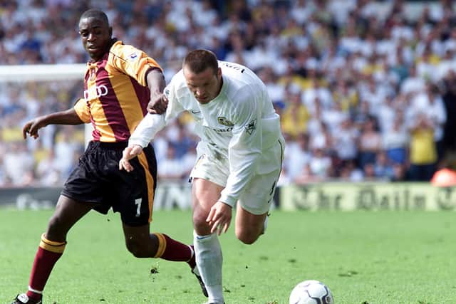 OUT IN FRONT: Leeds United forward Mark Viduka, one of six different scorers for the Whites, is challenged by Jamie Lawrence in the 6-1 rout of Bradford City at Elland Road of May 13, 2001. Picture by Alex Livesey/ALLSPORT via Getty Images.