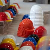 Hundreds of hard hats were laid out at Leeds College of Building to represent the tradespeople who have died by suicide.