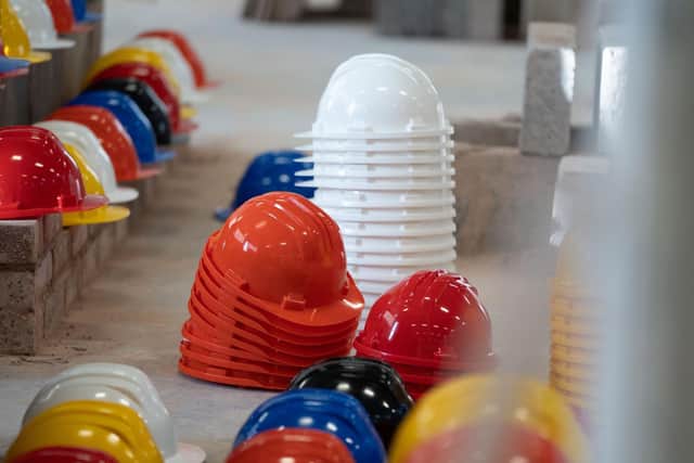 Hundreds of hard hats were laid out at Leeds College of Building to represent the tradespeople who have died by suicide.