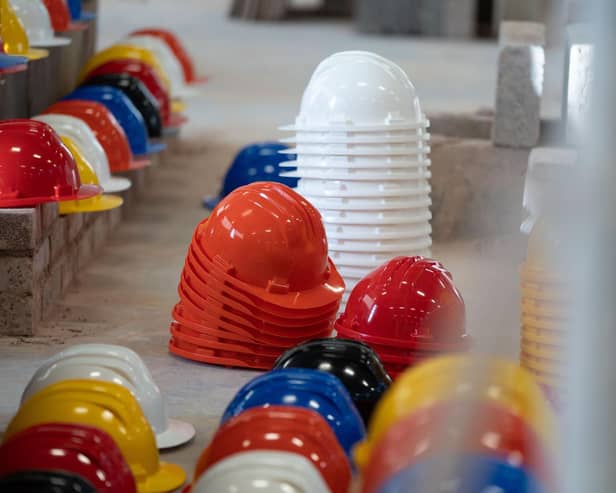Hundreds of hard hats were laid out at Leeds College of Building to represent the tradespeople who have died by suicide.