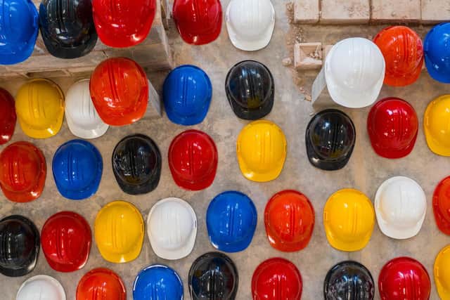 Hundreds of hard hats were laid out at Leeds College of Building to represent the tradespeople who have died by suicide.