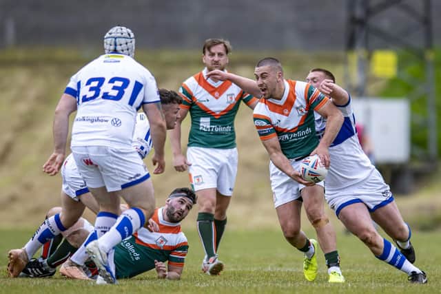 Vila Halafihi looks to offload against Workington. Picture by Tony Johnson.