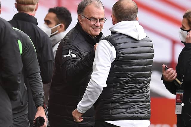 WARM WORDS: From Leeds United head coach Marcelo Bielsa, left, for former Sheffield United boss Chris Wilder, right, pictured ahead of September's clash between the Blades and Whites at Bramall Lane. Photo by OLI SCARFF/POOL/AFP via Getty Images.