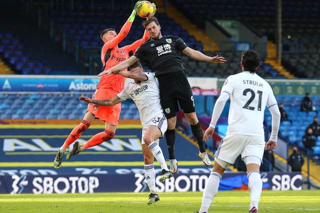 CHIEF THREAT: Burnley striker Chris Wood, centre, pictured challenging Leeds United 'keeper Illan Meslier and defender Luke Ayling in December's clash at Elland Road. Photo by Nigel French - Pool/Getty Images.