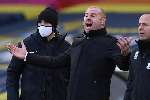 IT WASN'T ME: Says Burnley boss Sean Dyche, centre, who says he has been massively misquoted about Leeds United's transfer spend. Photo by OLI SCARFF/POOL/AFP via Getty Images.