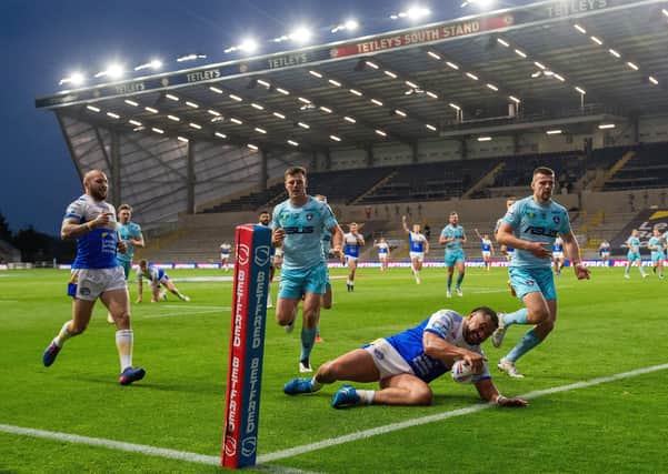 In a hurry: Konrad Hurrell scores the Rhinos' second try against Wakefield Trinity. Picture Bruce Rollinson