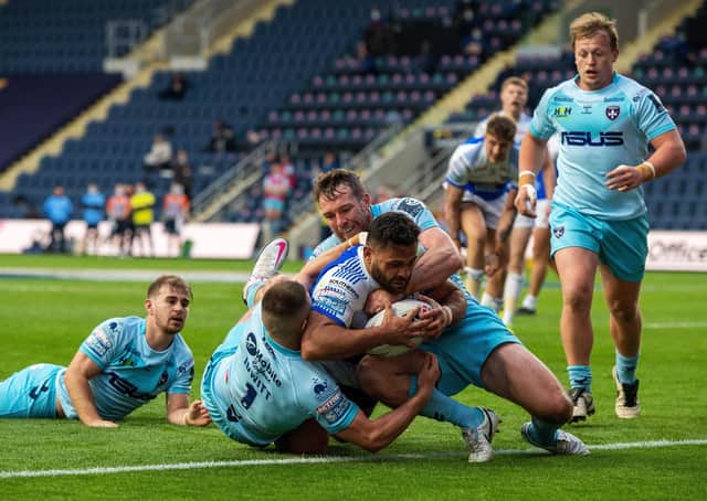 Match winner: Rhyse Martin heads for the line to score the Rhinos first try. He also kicked three goals including the golden point extra-time penalty. Picture Bruce Rollinson