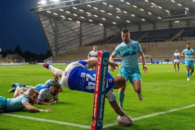 So close: Luke Briscoe drops the ball over the line for Leeds. Picture Bruce Rollinson