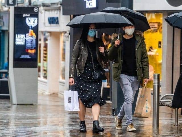 Shoppers in rainy Leeds.