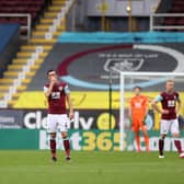 DISAPPOINTMENT: For Burnley and midfielder Jack Cork, centre, in Saturday's 4-0 defeat against Leeds United at Turf Moor. Photo by CARL RECINE/POOL/AFP via Getty Images.