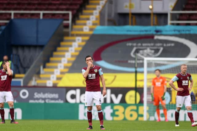 DISAPPOINTMENT: For Burnley and midfielder Jack Cork, centre, in Saturday's 4-0 defeat against Leeds United at Turf Moor. Photo by CARL RECINE/POOL/AFP via Getty Images.