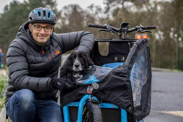 Man and dog in cycle trailer. Photo: Leeds City Council