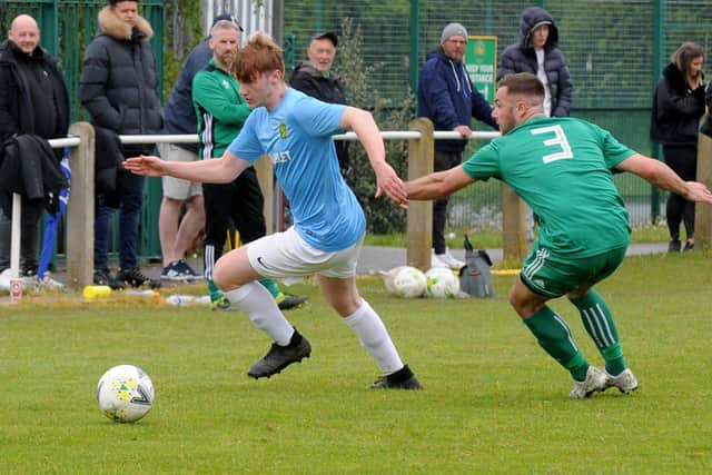 Mark Webb, of Hunslet,  turns Ben Thornton, of Beeston St Anthonys, during Saturday's West Yorkshire League Premier division encounter. Picture: Steve Riding.