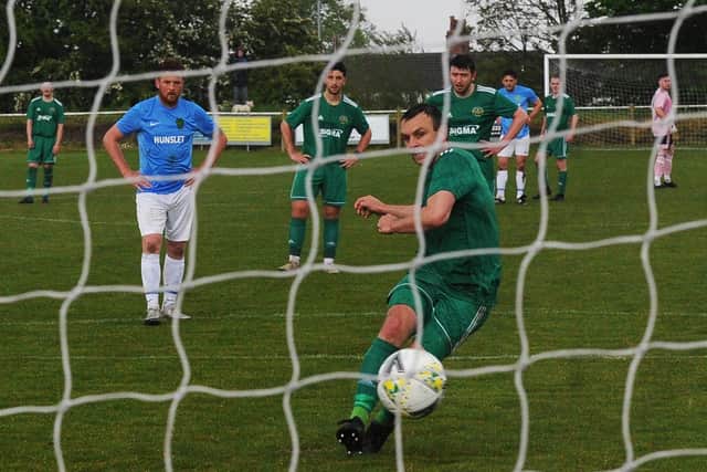 Lee Turner scores from the penalty spot in Beeston's 3-1 win over visiting Hunslet. Picture: Steve Riding.