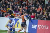 Jake Trueman celebrates with Tigers' fans after scoring against St Helens at the Jungle last year. Picture by Tony Johnson.