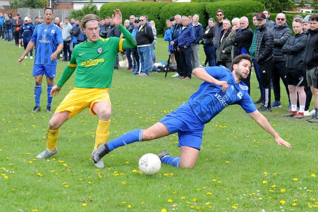 A healthy crowd looks on as Joe Taskler, left of Main Line Social, gets the better of HT Sports' Joe Beddard. Picture: Steve Riding.