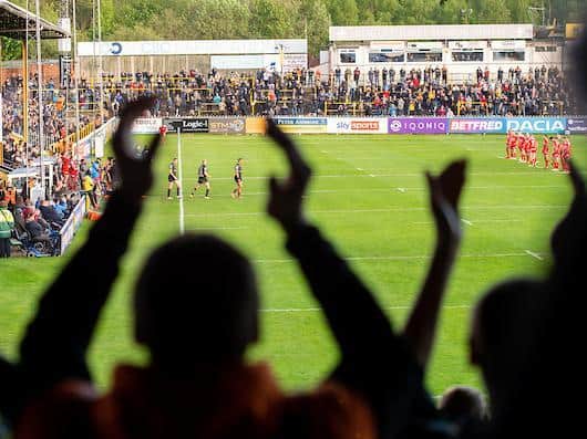 Tigers fans welcome their team on to the field before the game against Hull KR. Picture by Allan McKenzie/SWpix.com.