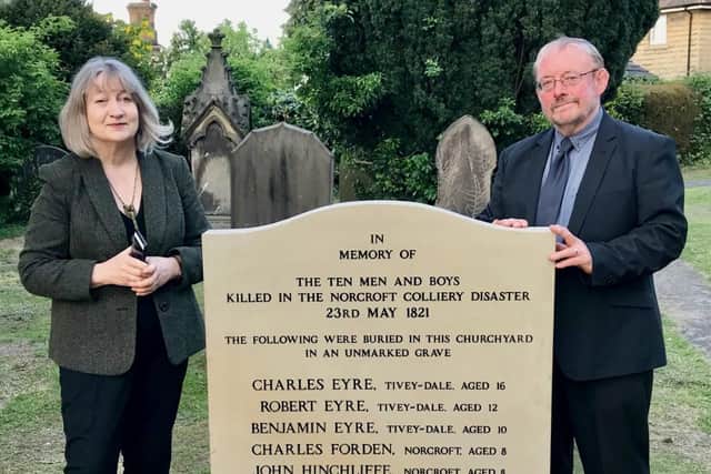 Julia and David Hinchlife with the memorial to the miners who died in Norcroft in 1821