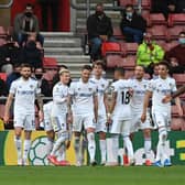 JOB DONE: For Leeds United and Patrick Bamford, back middle, as Tuesday evening's 2-0 win at Southampton, above, sealed a Premier League top-half finish for the first time in 19 years. Photo by Neil Hall - Pool/Getty Images.