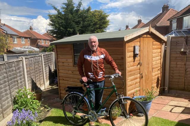 Ken Sykes prepares for his fund-raising ride.