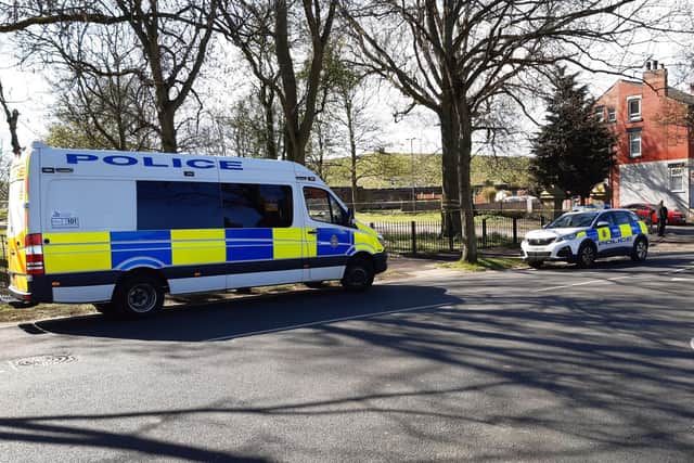 Police vehicles at a previous incident at Harehills Park.