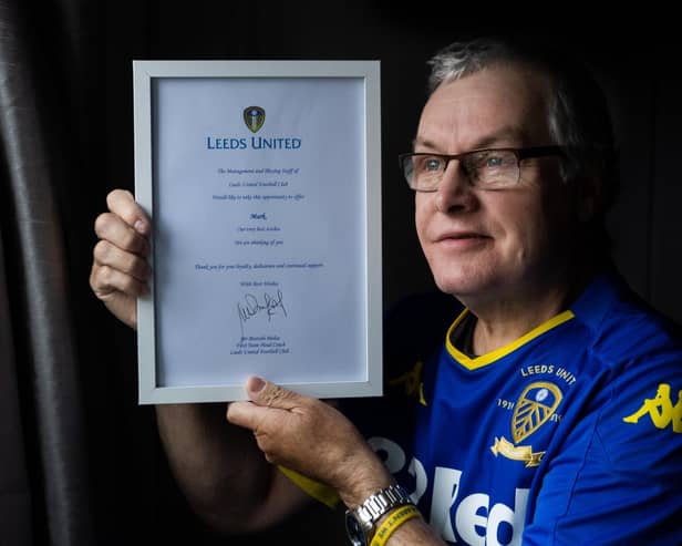 Leeds United fan Mark White with the message signed by club manager Marcelo Bielsa. Picture: James Hardisty