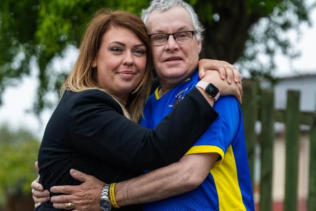 Tanya Gibbons with dad Mark White after learning he has been given tickets for Sunday's Leeds game against West Brom. Picture: James Hardisty