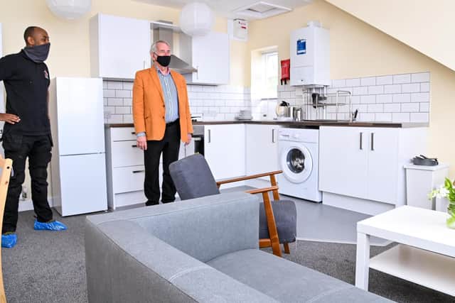 The top floor - pictured: Ermias Solomon (refurb worker) , Dave Cook (architect)