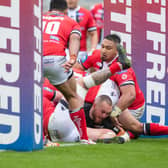 Daniel Smith scores for Tigers in their Challenge Cup quarter-final win over Salford. Picture by Tony Johnson.