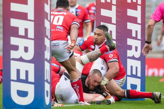 Daniel Smith scores for Tigers in their Challenge Cup quarter-final win over Salford. Picture by Tony Johnson.