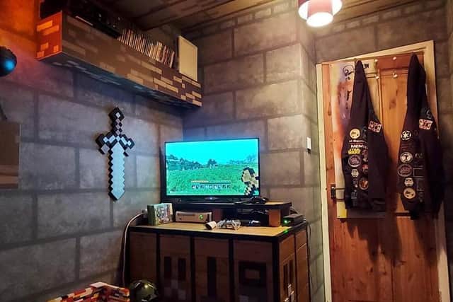 Mark McFarlane, 48, let his grandchildren Oscar, 7, and Finn, 4, watch the progress of their incredible new bedroom on Facetime as he got to work creating shelves, cupboards and wall decorations inspired by the hit video game.