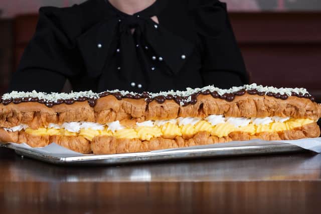 Jamie Wilson, 27, has challenged dessert lovers to try to tame the ‘eclair to end all eclairs’ - but said the dessert would scare even the most sweet toothed among us.
cc SWNS