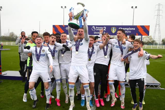 THE FUTURE: Captain Charlie Cresswell and the rest of the Leeds United under-23s team celebrate getting their hands on the Premier League 2 Division Two title winners' trophy. Picture by LUFC.