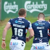 Happy return: Wakefield Trinity's Jacob Miller celebrates after scoring a try on his return from injury, with Max Jowitt and James Batchelor.  Picture: Dean Williams