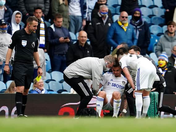 CONCERN: Leeds United's England international midfielder Kalvin Phillips receives treatment in the closing stages of Sunday's 3-1 victory against West Brom at Elland Road. Photo by Jon Super - Pool/Getty Images.