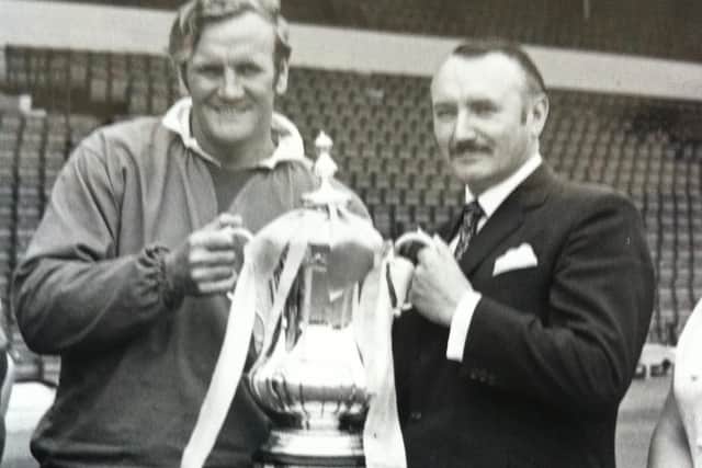 Geoff Williams with Leeds United manager Don Revie holding the FA Cup