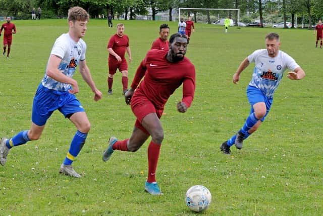 Ryan Mills bursts through for Little London in their 3-0 win over Leeds Combination League Division 3 title rivals Old Crooked Clock. Picture: Steve Riding.