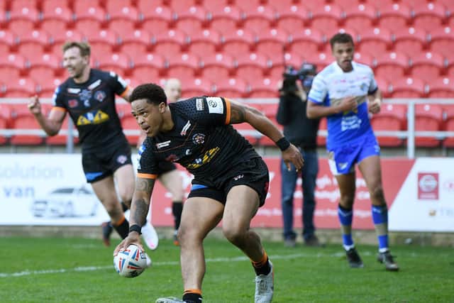 Jordan Turner scores for Tigers against Leeds in April. Picture by Jonathan Gawthorpe.
