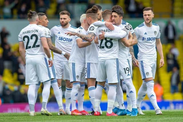 Leeds United embrace at Elland Road on the final day of the season.