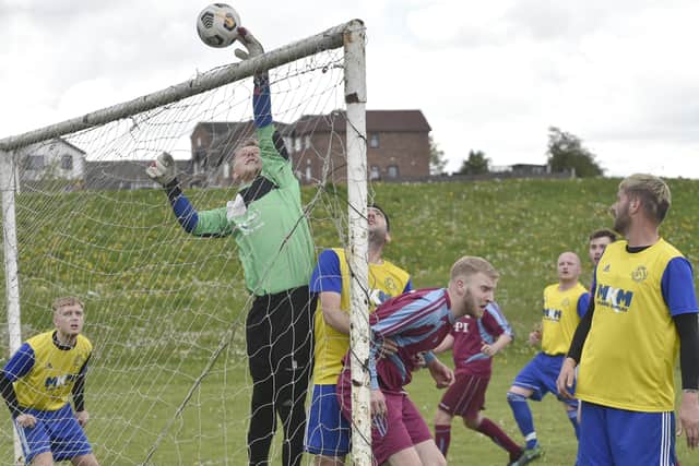 Stanningley OB Res goalkeeper Brad Longthorpe tips the ball over for a corner in the 2-0 defeat to Norristhorpe Rangers who hold a nine-point lead at the top of the Division 3 table. Picture: Steve Riding.