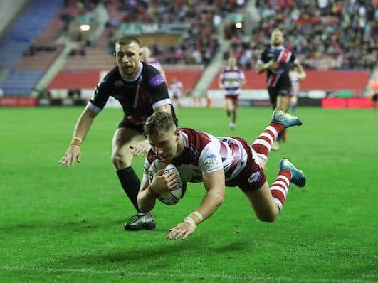George Williams scores for Wigan against Salford in 2019. Picture by Oskar Vierod/SWpix.com.