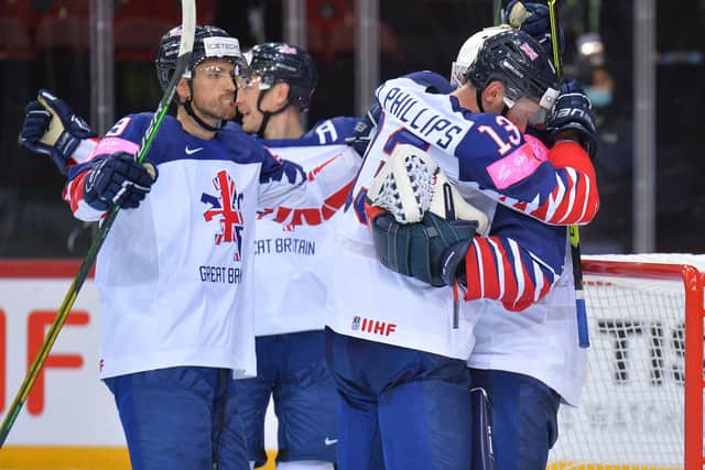 MEMORABLE: Great Britain's players celebrate their 4-3 win over Belarus on Wednesday night. Picture courtesy of Dean Woolley.