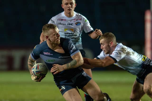 BANNED: Featherstone's Ben Blackmore is held by Jarrod O'Connor. 
Picture:  Bruce Rollinson
