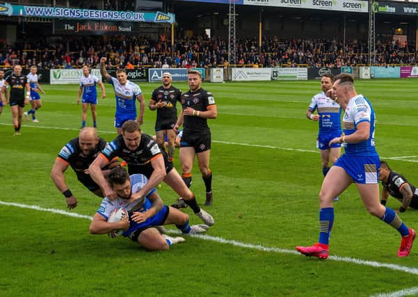 First of many: Tom Briscoe scores the Rhinos' first try.
  Picture Bruce Rollinson