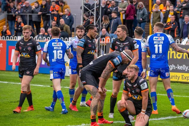 Tigers are dejected as Rhinos celebrate one of their 11 tries. Picture by Bruce Rollinson.