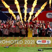 Brentford captain Pontus Jansson lifts Championship play-off final trophy at Wembley. Pic: Getty